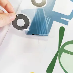 Detail of self-adhesive cartoon car wall sticker being peeled from a white surface