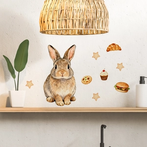 Nursery wall decals featuring a watercolor bunny with stars and snack elements on a wall