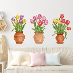 Detailed watercolor tulip wall stickers on white wall above light fabric sofa