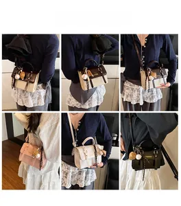 Detail view of various retro small square bags with fashion charms and scarf wrap
