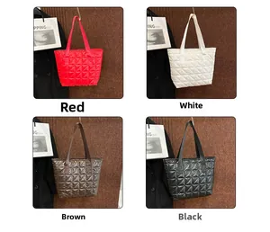 Quilted tote bags shown in four colors including red, white, brown and black finishes