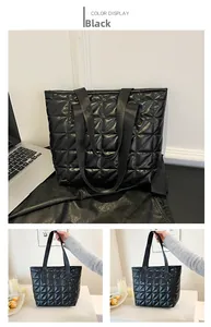 Detail view of black quilted tote bag with diamond pattern stitching for daily commute