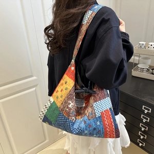 Bohemian reversible patchwork denim bag with ethnic patterns and geometric textures