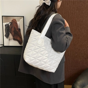 White quilted tote bag with diamond stitching and large capacity for daily commuting