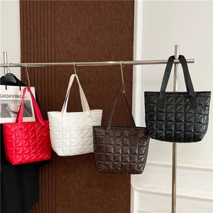 Quilted tote bags in red, white, brown, and black with shiny finish and large capacity