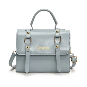 Vintage light blue leather crossbody bag with golden hardware and fashion logo