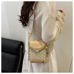 Detail of beige letter print crossbody bag with heart lock and wide fabric shoulder strap