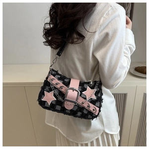 Detail of tweed crossbody bag with pink leather stars and silver metal chain buckle