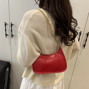 Chic red hobo shoulder bag with glossy finish and gold chain strap for women