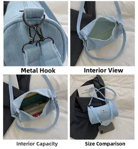Detail view of light blue denim barrel bag with metal hardware and spacious interior