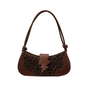 Stylish leopard print baguette bag with golden lightning buckle and knotted strap
