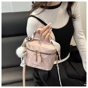 Pink marble texture box bag featuring a printed scarf handle and plush ball charm