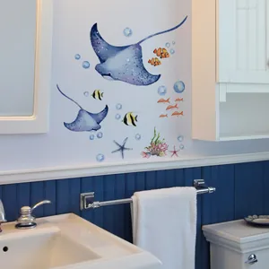 Bathroom wall decor showing watercolor marine animal stickers with manta rays and fish
