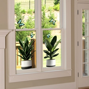 Detail of static window clings featuring realistic potted plants and blue butterflies
