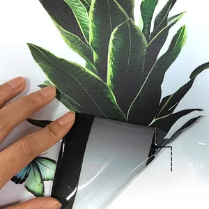 Detail showing the double-sided color printing of tropical leaves and butterfly stickers