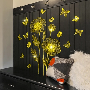 Luminous yellow floral and butterfly wall decals on dark wood panel for home decor