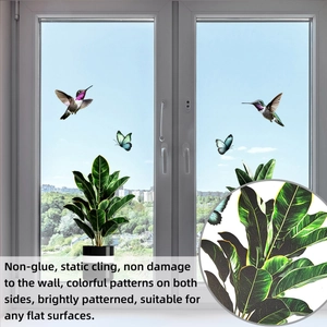 Detail of hummingbird and butterfly static cling stickers on a bright window pane
