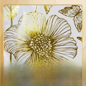 Macro detail of golden hot stamping floral and butterfly patterns on white wall sticker