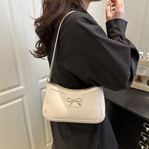 Chic off-white crescent underarm bag for women with gold bow detail and leather strap
