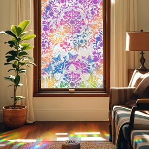 Rainbow mandala and butterfly static window film creating colorful suncatcher light effects