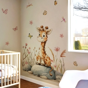 Cartoon giraffe and watercolor flower wall stickers in a cozy nursery room setting