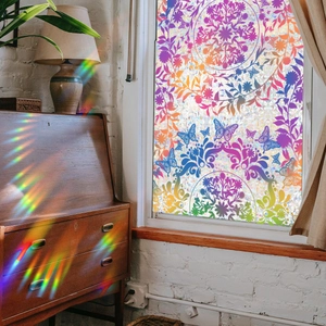 Rainbow sun catcher window film showing colorful mandala patterns and light refraction effects