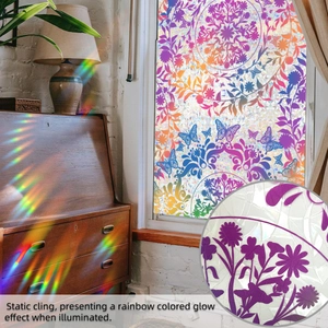 Close-up of mandala and butterfly window film showing prismatic rainbow light effect