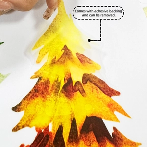 Detail showing self-adhesive backing on watercolor pine tree wall sticker for easy removal