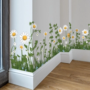 Wandtattoo mit Gänseblümchen und Gras für die Sockelleistendekoration im Wohnzimmer