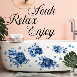 Blue watercolor floral wall stickers with 'Soak, Relax, Enjoy' script on bathroom wall
