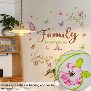 Detail of colorful floral wall stickers with Family is everything text and removable adhesive