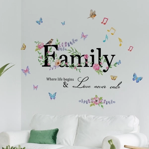 Family quote wall decal with watercolor flowers and butterflies on a white living room wall
