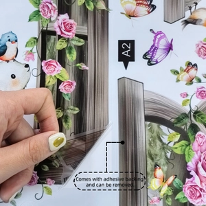 Detail of self-adhesive rose and panda wall decal showing easy peel backing