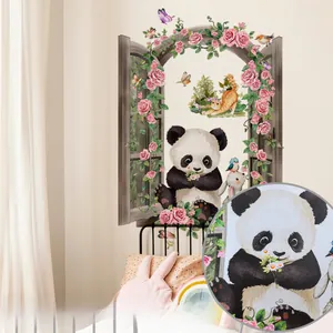 Adhesive wall sticker showing a panda in a rose-wrapped window for kids' room