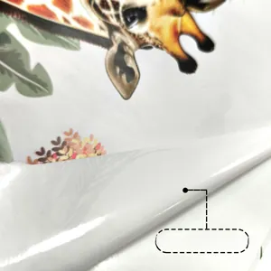 Close-up of giraffe wall sticker showing adhesive backing and thickness of the PVC material