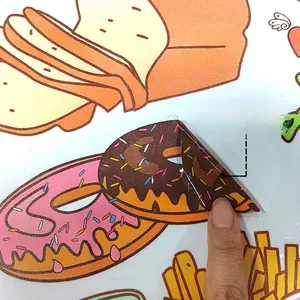 Close-up of double-sided cartoon food stickers showing bread and donuts printed on both sides