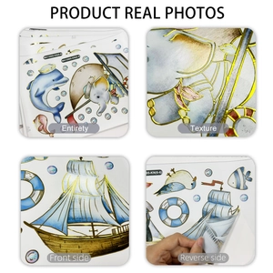 Detail of nautical wall stickers with gold stamping dolphin and sailboat designs