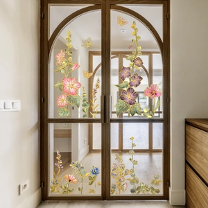Floral and butterfly static window clings with gold edges on an arched glass door