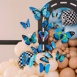 Detailed 3D blue butterfly wall stickers with intricate wing patterns on party balloons