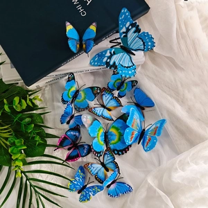 Detailed top view of realistic blue 3D butterflies on a textured white fabric background