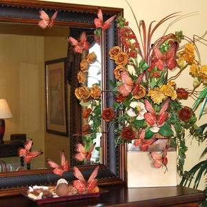 3D realistic orange butterfly wall stickers with golden foil details in home decor setting