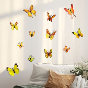 Detailed view of 3D gradient orange butterfly wall stickers in a modern home interior