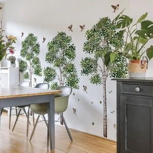 Watercolor birch trees and birds wall stickers in a bright living room decor scene