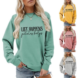 Detail view of cotton blend sweatshirts with ribbed cuffs and pilates slogan in multiple colors