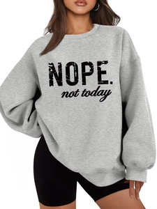 Close-up of the vintage 'NOPE. not today' print on a grey long-sleeve fleece sweatshirt