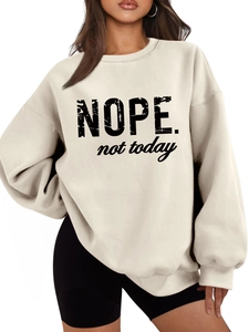 Close-up of Nope Not Today slogan print on cream fleece oversized long sleeve sweatshirt
