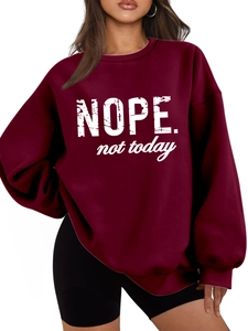 Detail of burgundy oversized hoodie featuring white Nope Not Today graphic print
