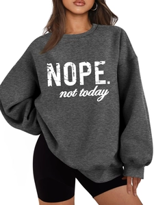 Close-up of NOPE not today slogan and ribbed cuffs on charcoal grey fleece sweatshirt