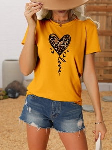 Detail of yellow round neck T-shirt with leopard print heart and love lettering design