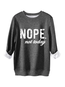 Detail of dark grey sweatshirt featuring soft fleece lining and Nope Not Today slogan